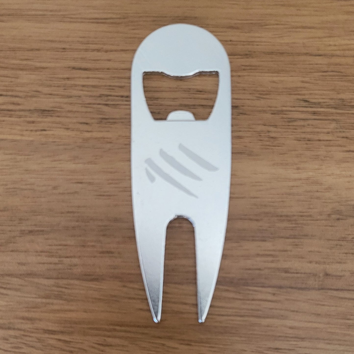 Golf divot tool with bottle opener